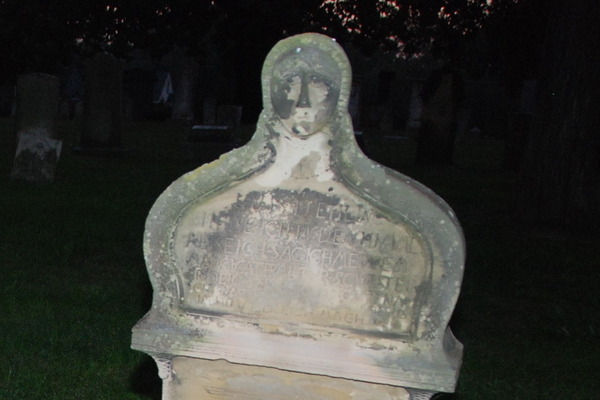 Evangelical St. Marcus Cemetery: face in the stone